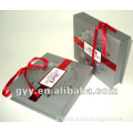 Fancy paper box with red ribbon